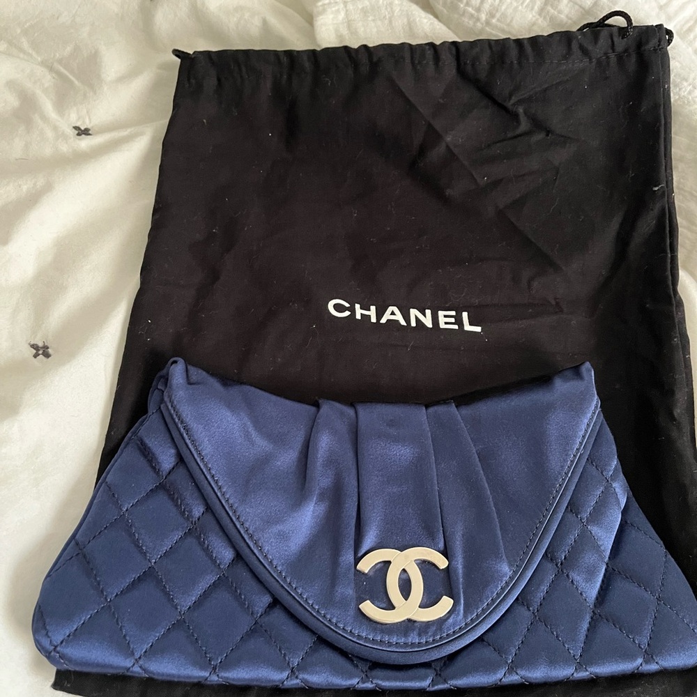 This is a blue Authentic Chanel mini clutch. Never used.